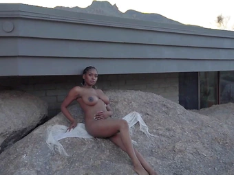 Huge boobs ebony MILF model Nyla solo striptease outdoor for Playboy
